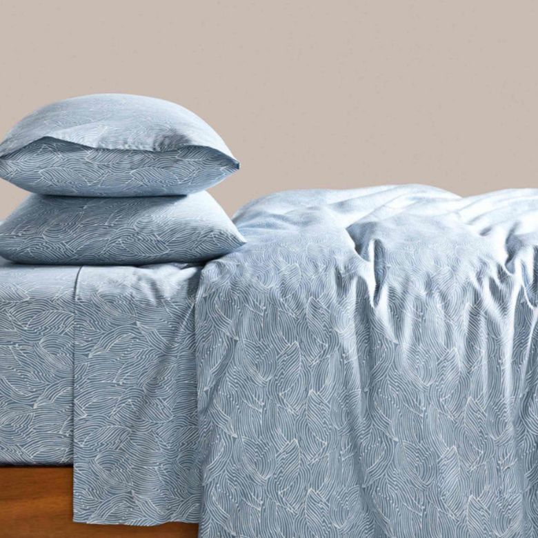 blue duvet cover with white leaf line designs