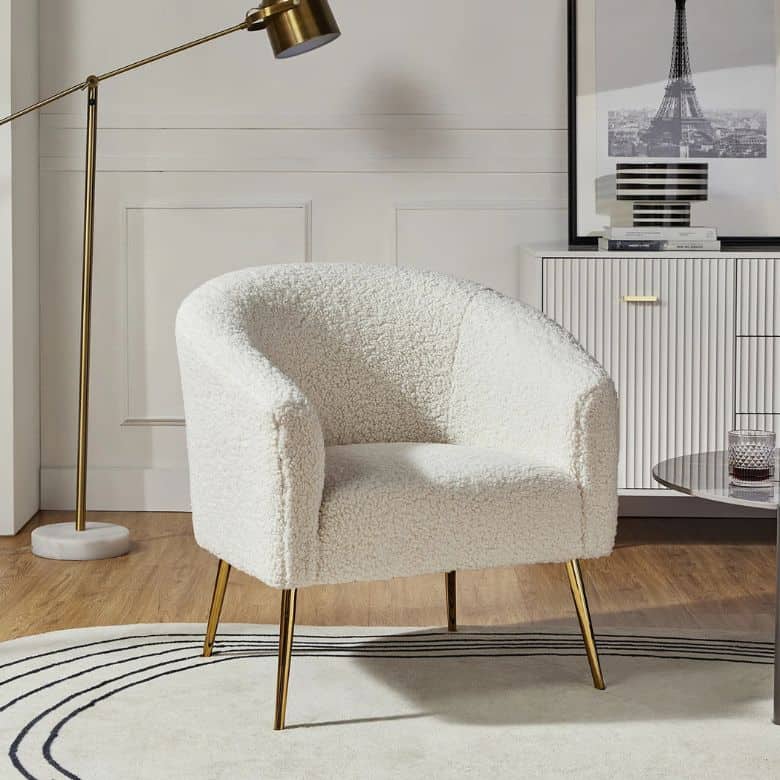 white boucle arm chair with legs