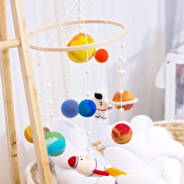 outer space-themed nursery mobile