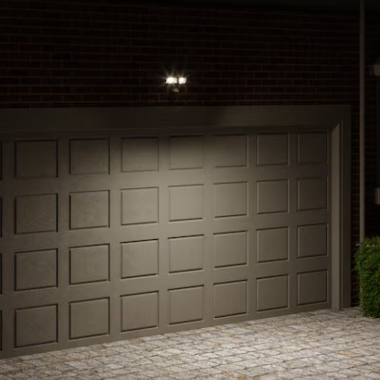 Bronze 2-Head Motion-Activated Flood Light Above Garage Door