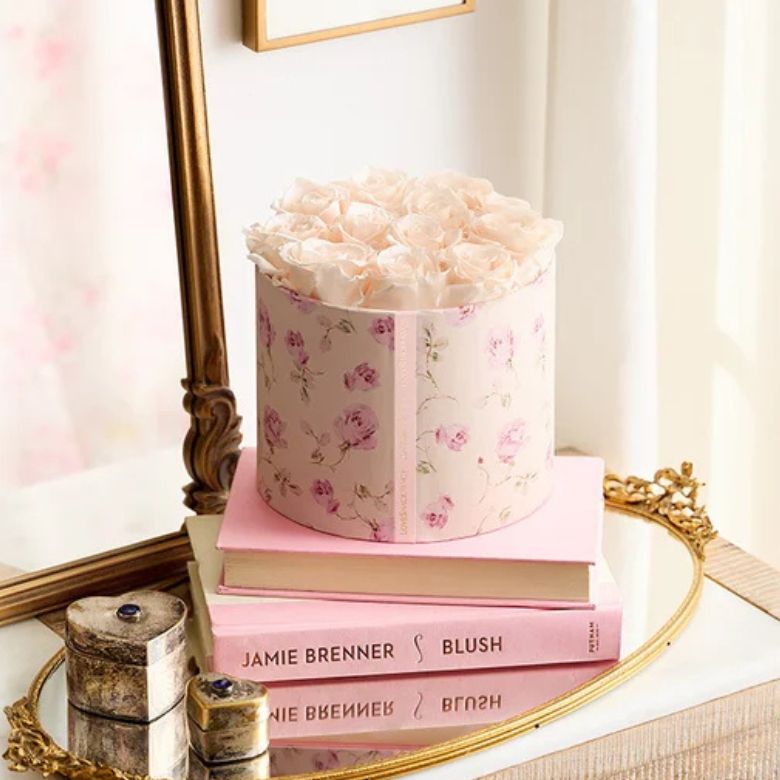 preserved porcelain-white roses in a hatbox-style container