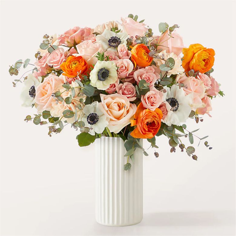 bouquet of ranunculus, anemone, and roses