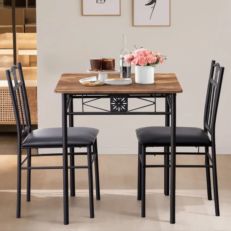 raised wooden rectanglular dining table with 2 upholstered chairs