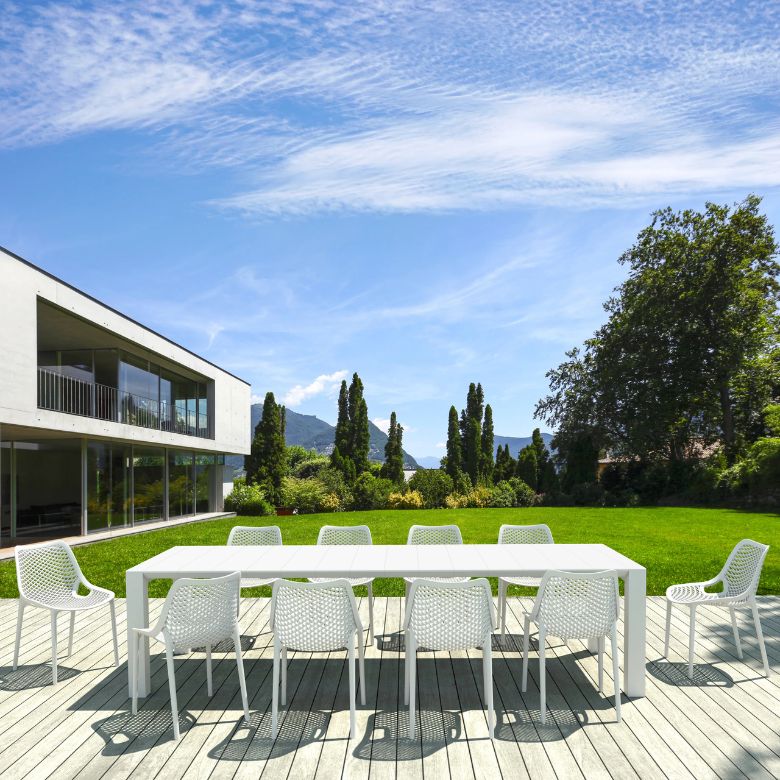 white rectangular extendable outdoor dining table and chair set