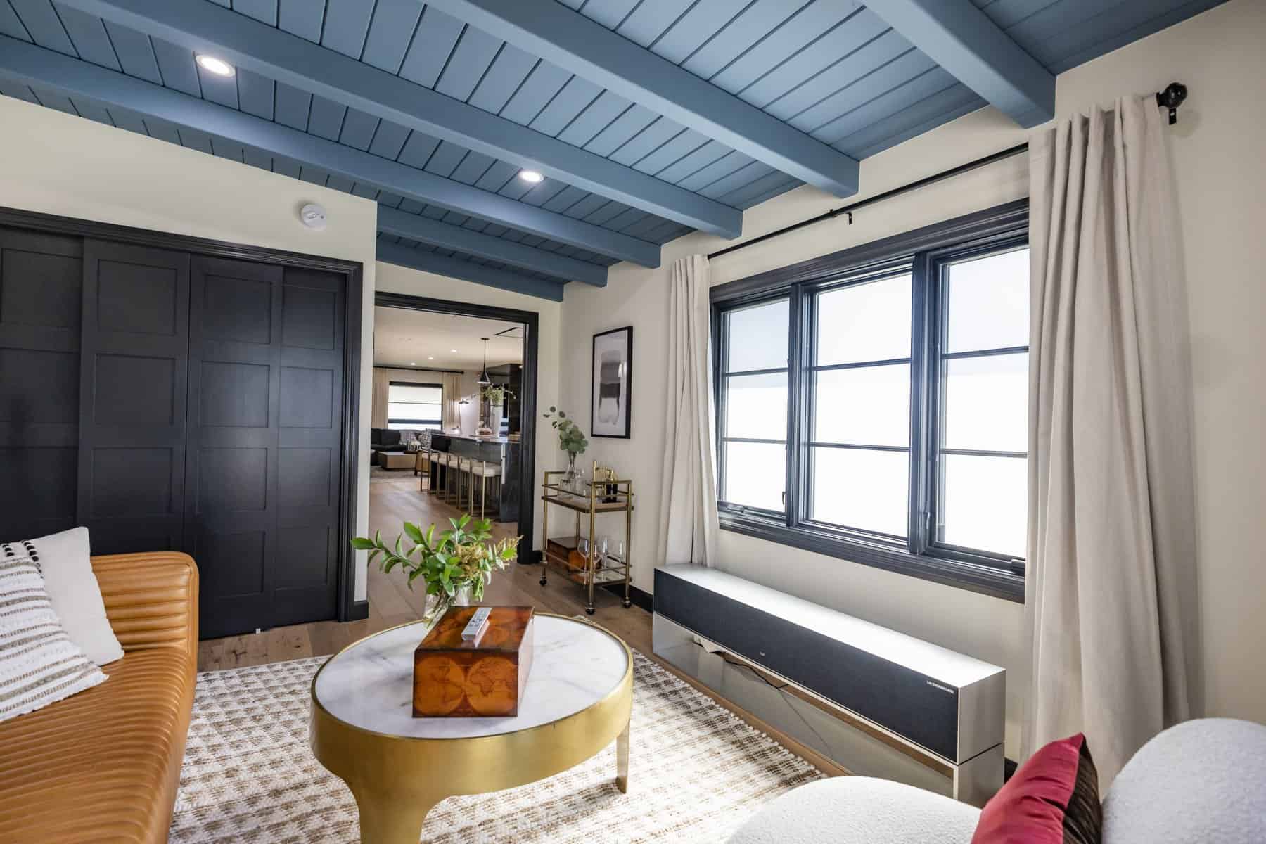 Cozy sitting area with blue ceiling and modern decor