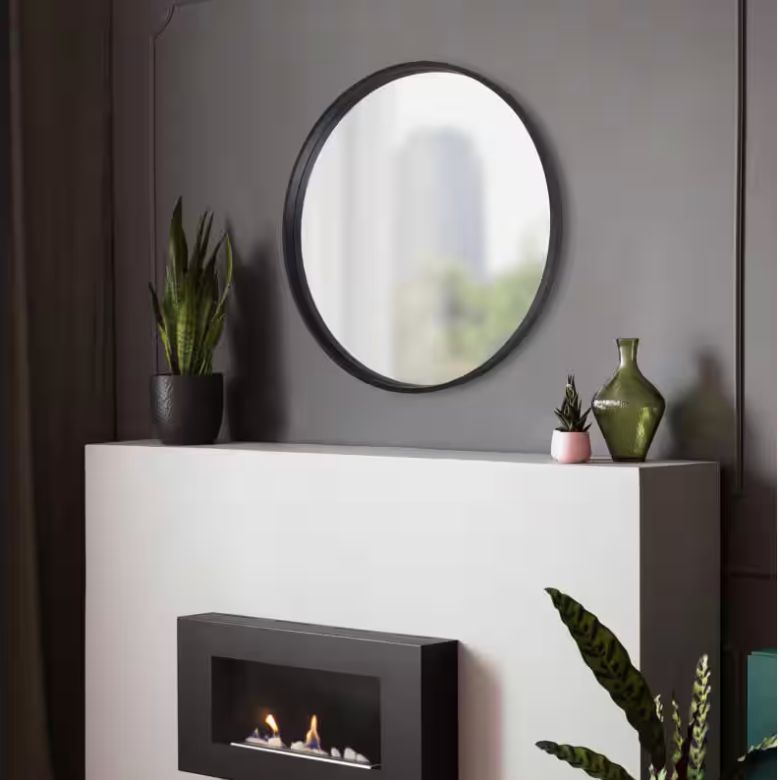 black metal round mirror