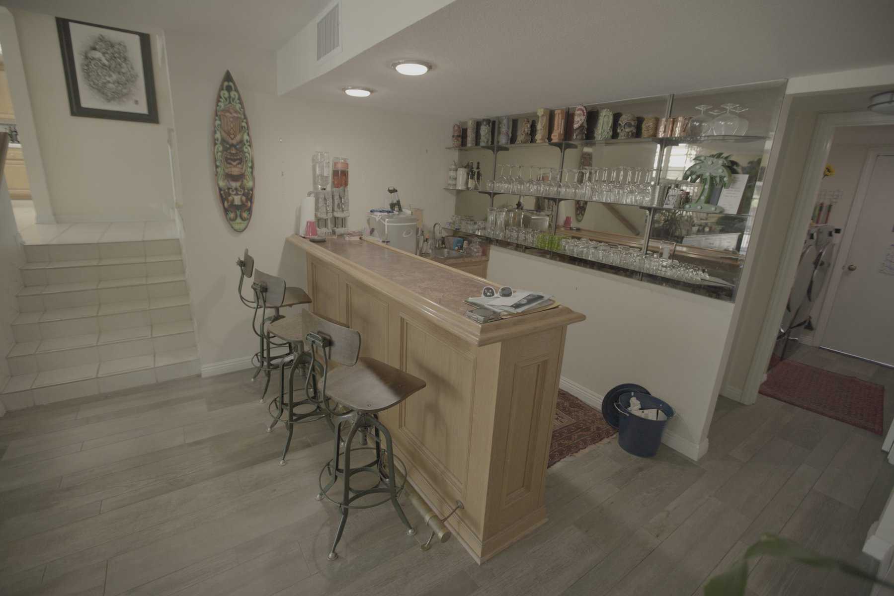 Bar interior: stools, counter, shelves