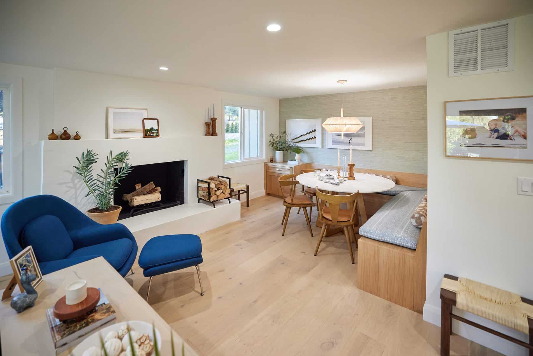 Cozy living and dining area with a fireplace and round dining table