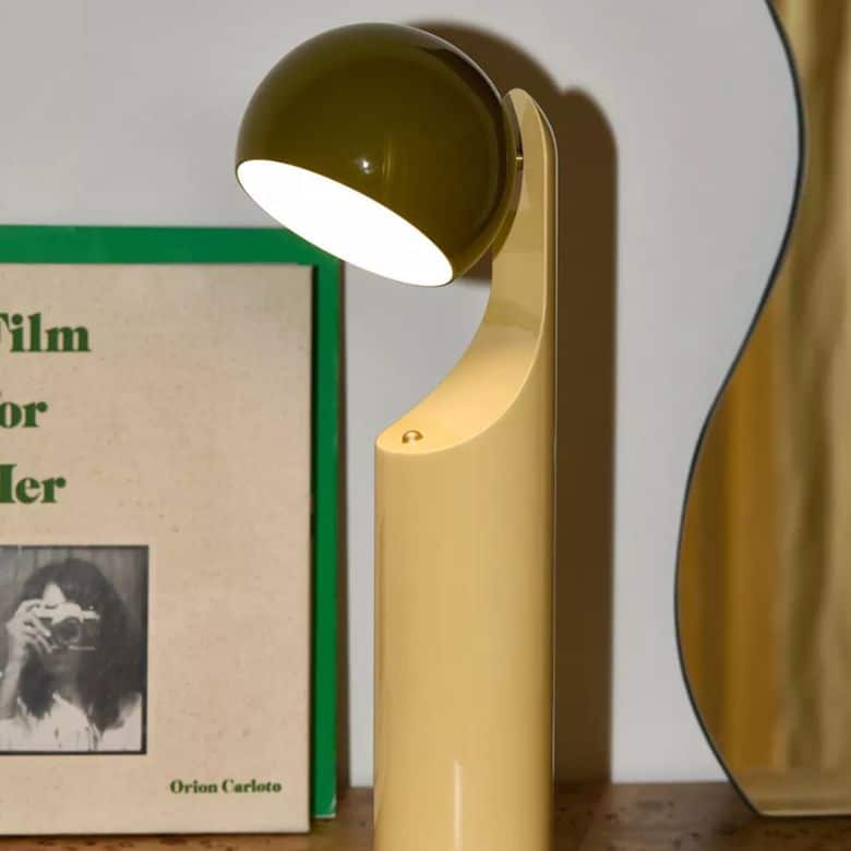 green portable cylindrical table lamp with a bubblegum-shaped shade
