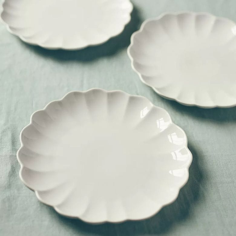 white scalloped dinner plates