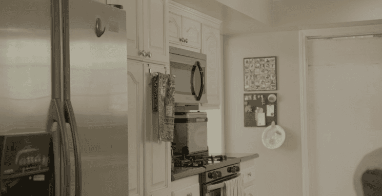 Kitchen with stainless steel appliances and hanging towels