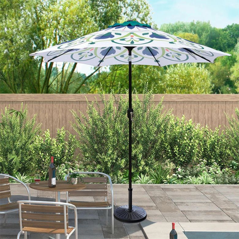 white canopy umbrella with blue, green, and orange floral designs