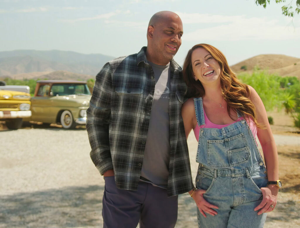 chasing the west premiere couple tawny and miguel smiling on their new property in Agua Dulce, California