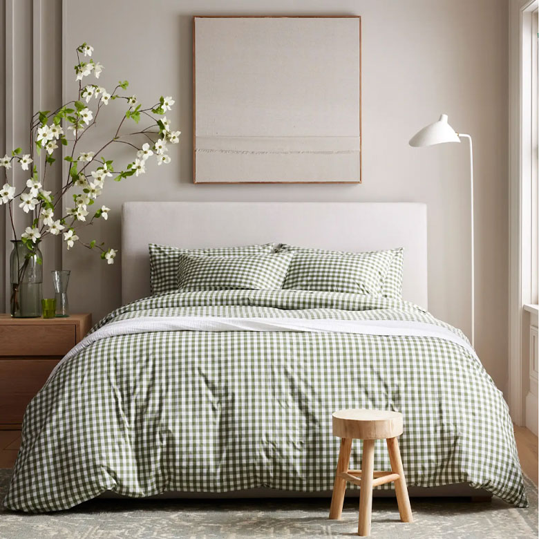 olive green gingham bedding in a cozy bedroom