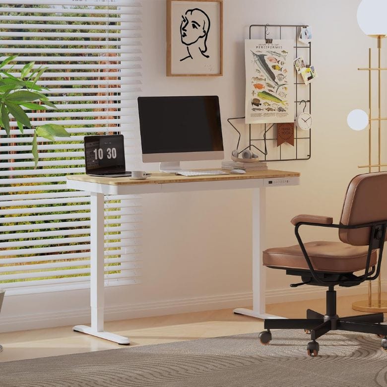adjustable standing desk with white legs and wood top