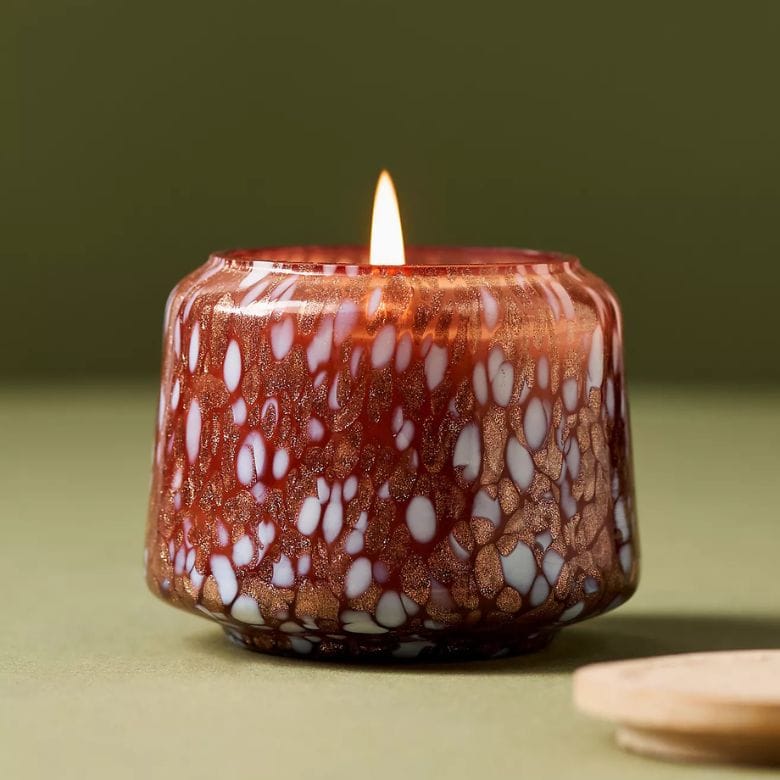 Honeycrisp Oakwood Scented Candle in red and white marbled glass jar