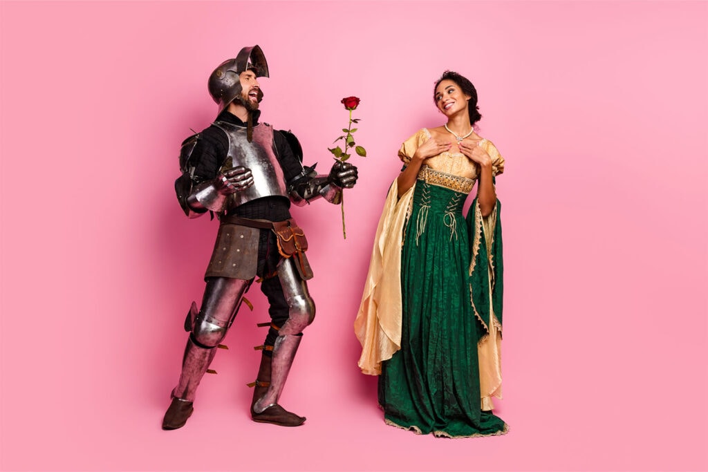 couple dressed as a renaissance knight and a queen