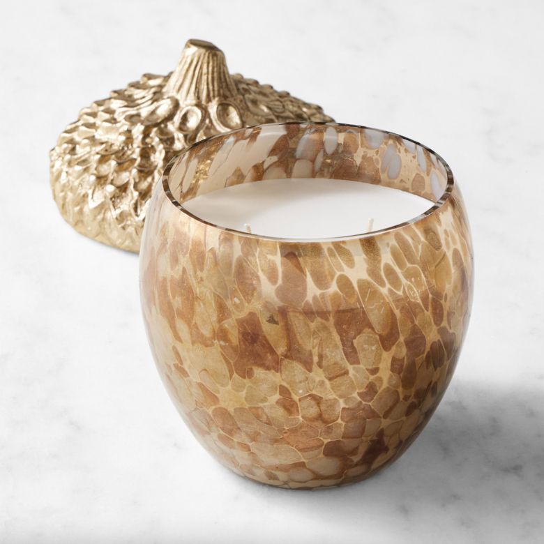 spiced chestnut scented candle in acorn-shaped glass jar