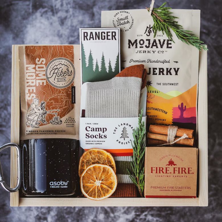 Camping Gift Set with Campfire Mug, Camp Socks, Jerky, Fire Starters, Chocolate Bar & S'mores Coffee