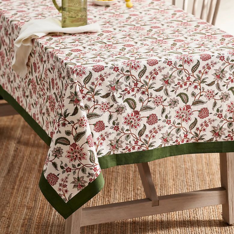 white tablecloth with red and green botanical designs