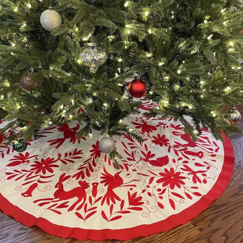 red and white embroidered christmas tree skirt