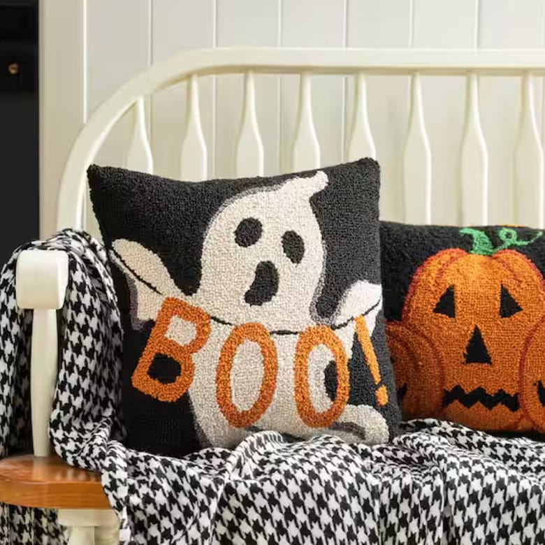cute pillow with ghost holding "BOO" lettering
