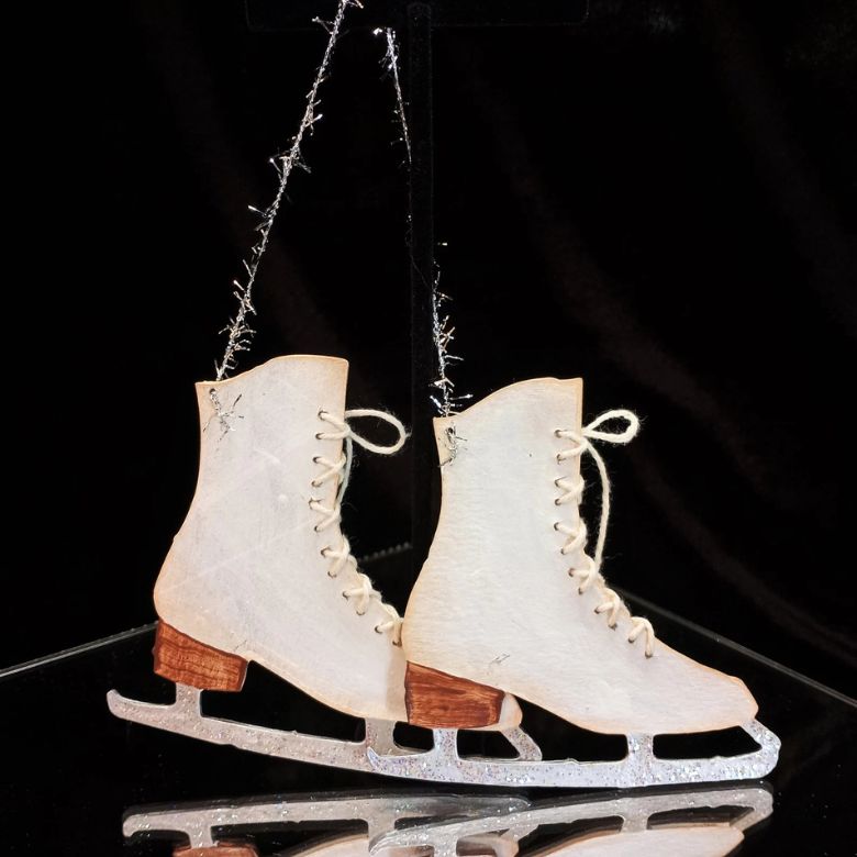 white decorative ice skates