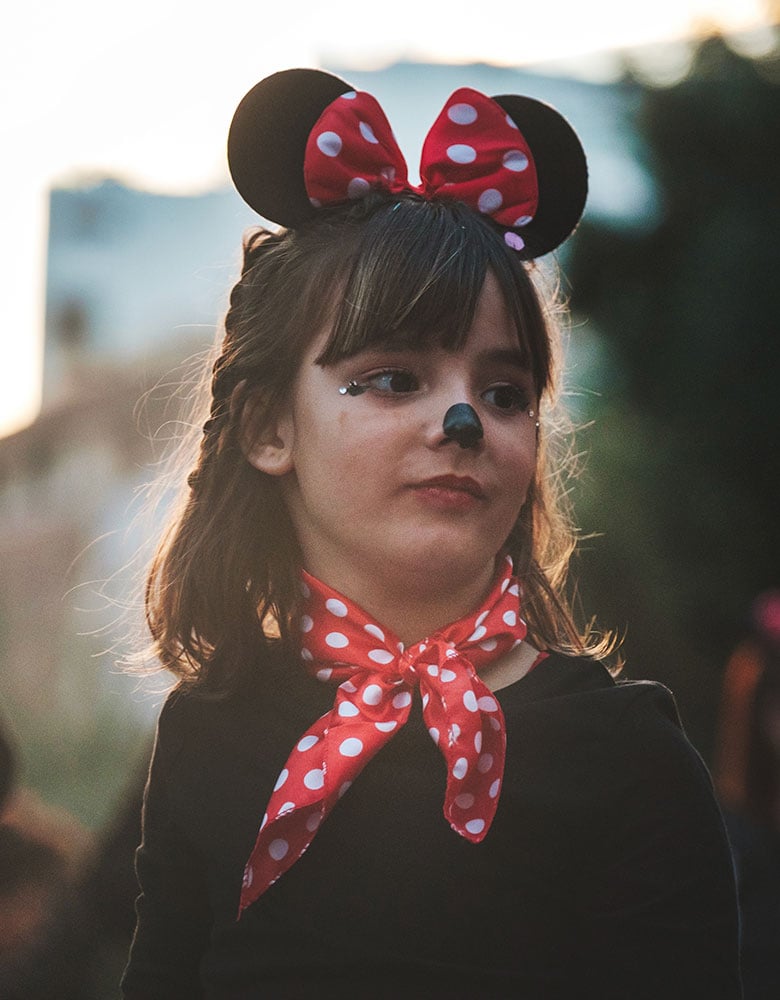 child dressed up as minnie mouse