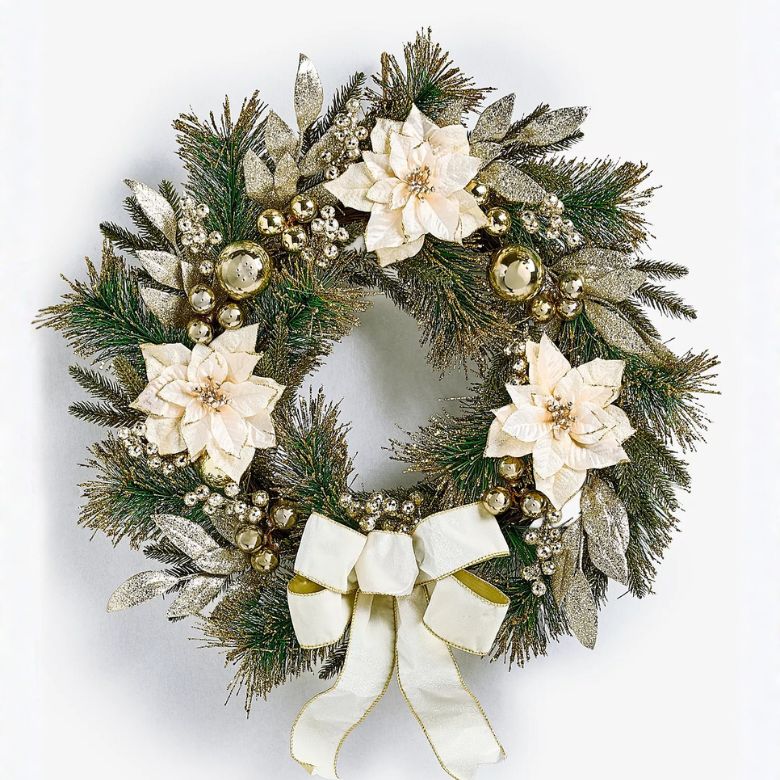 holiday wreath with white poinsettias and white bow