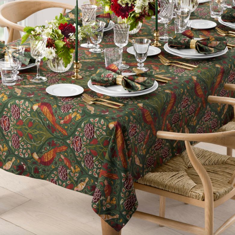forest green tablecloth with deep burgundy, orange, and yellow motifs