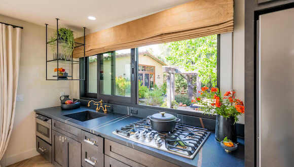Kitchen stove and large windows