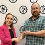 Novus awards animal ag educator during poultry meeting