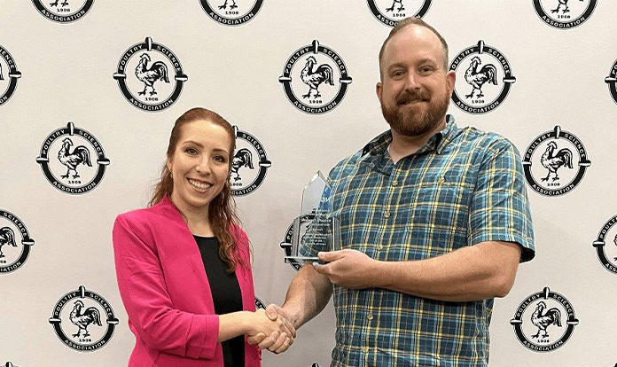 Novus awards animal ag educator during poultry meeting