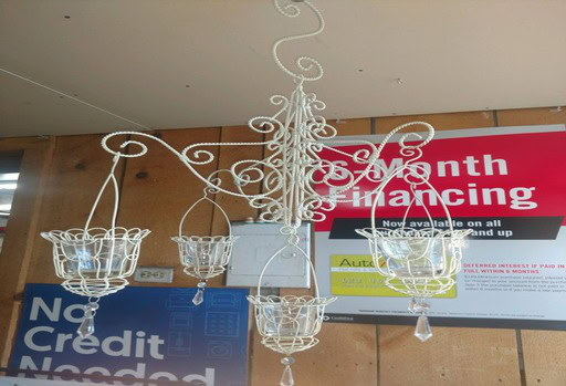 Elegant chandelier with glass baskets for decorative lighting.