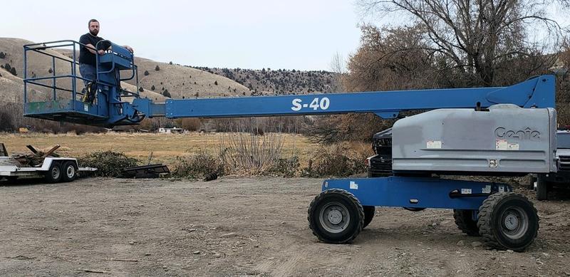 Heavy-duty aerial lift for equipment and party rentals at Frontier Repair & Towing.