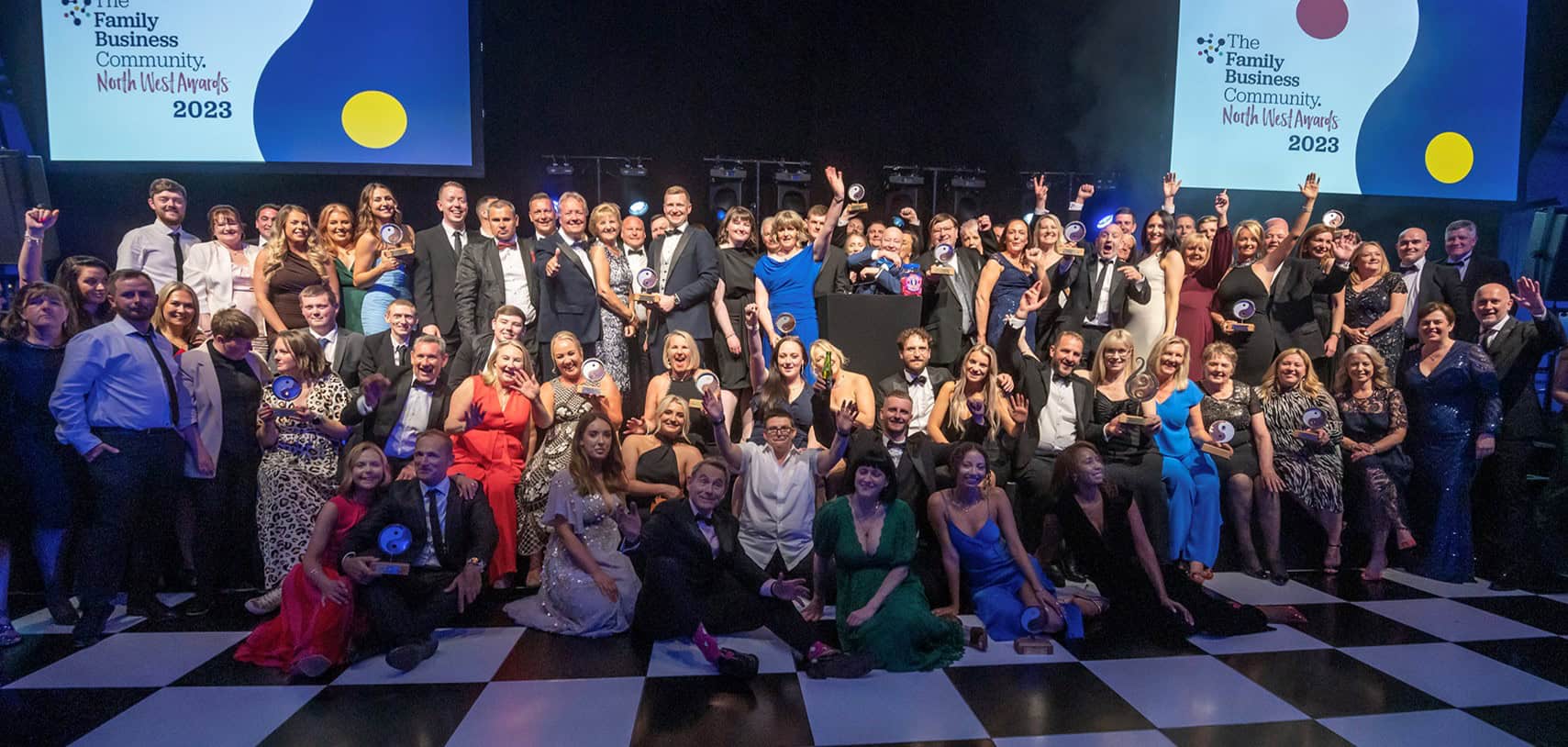 Award-winning group celebrating at The Family Business Community North West Awards 2023, showcasing success and team achievement.