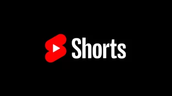 Shorts logo with red play button icon and bold white text on black background, representing YouTube Shorts and short-form video content.