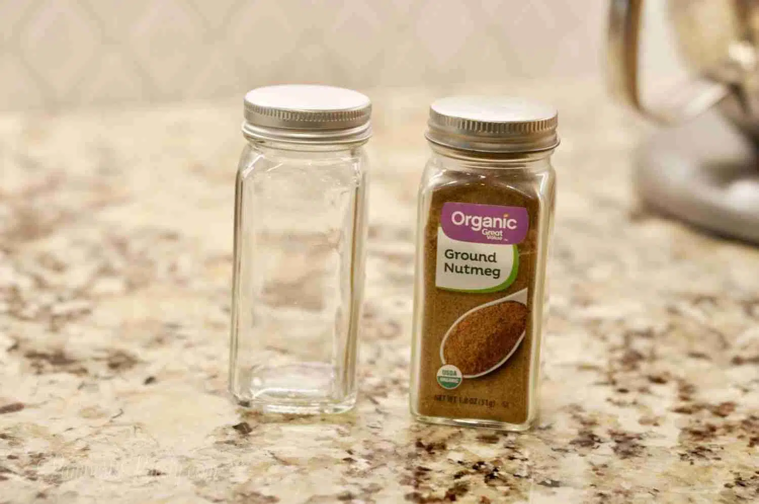 empty glass jar next to a matching full glass jar from walmart.