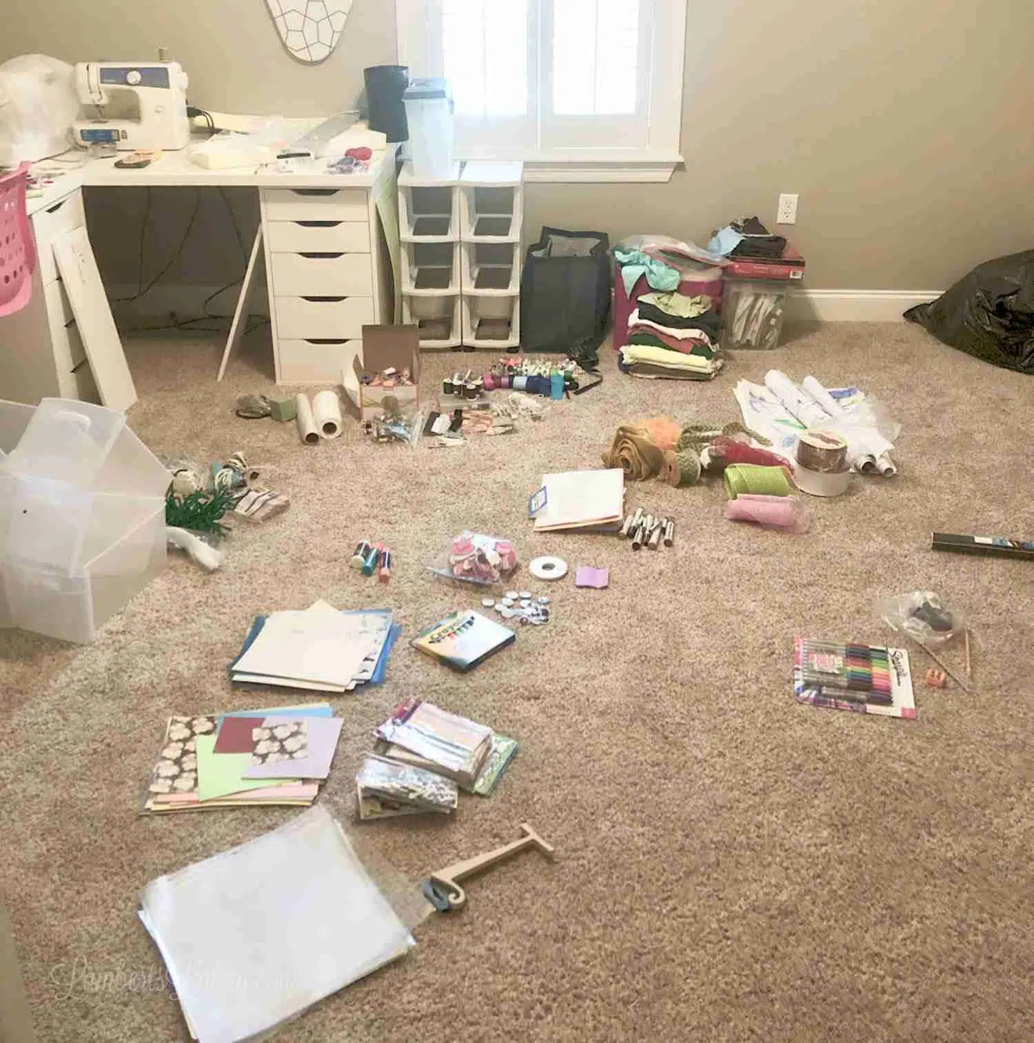 craft supplies scattered on carpeted floor.