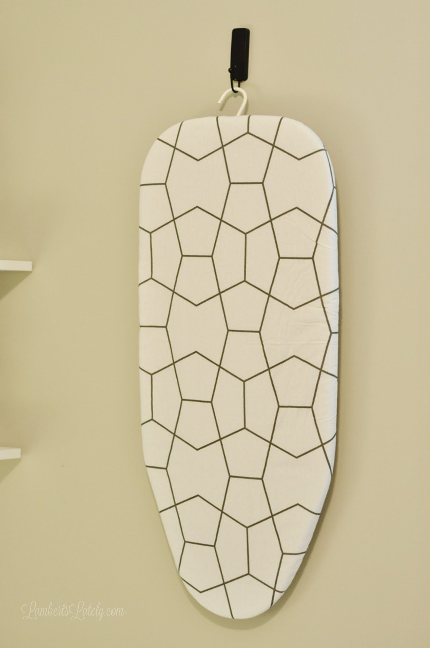 ironing board hanging on a wall.