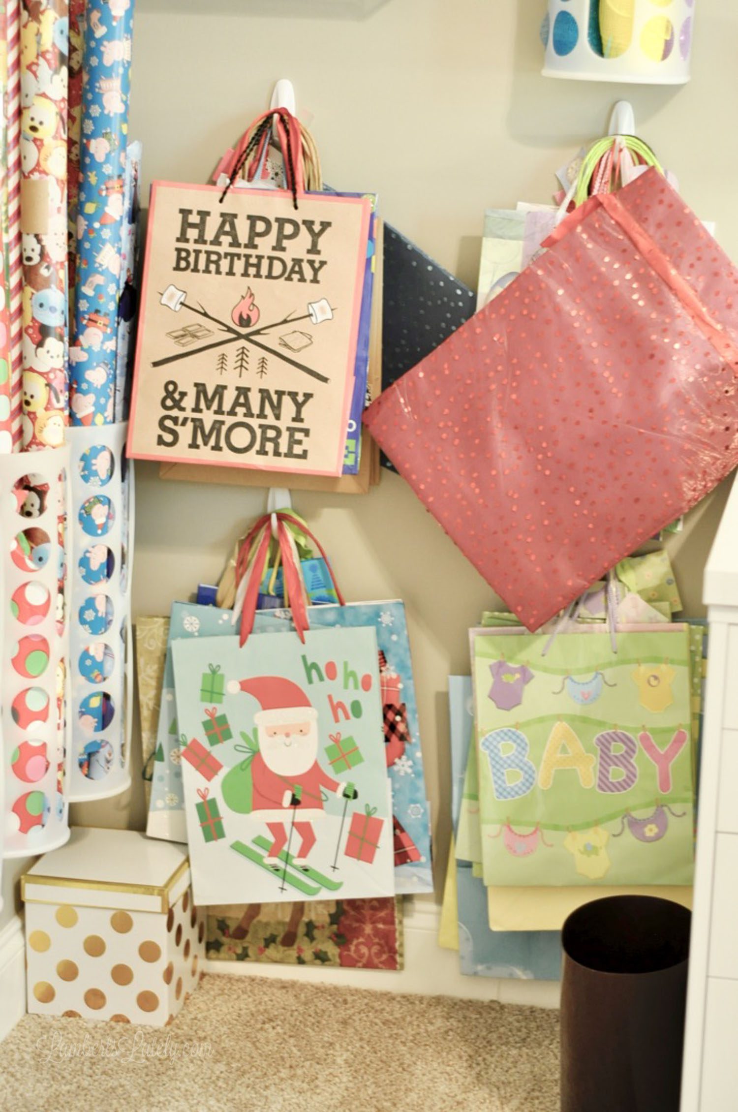 gift bags hanging on a wall.