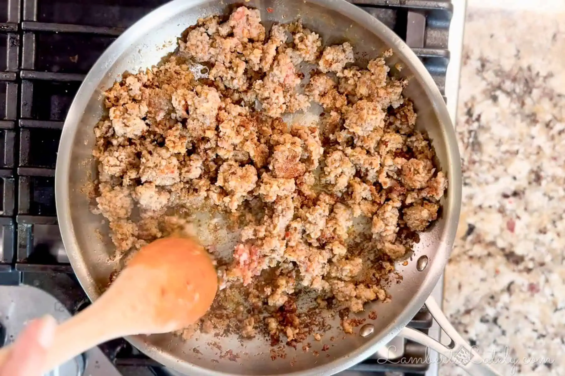 cooking sausage in a skillet.