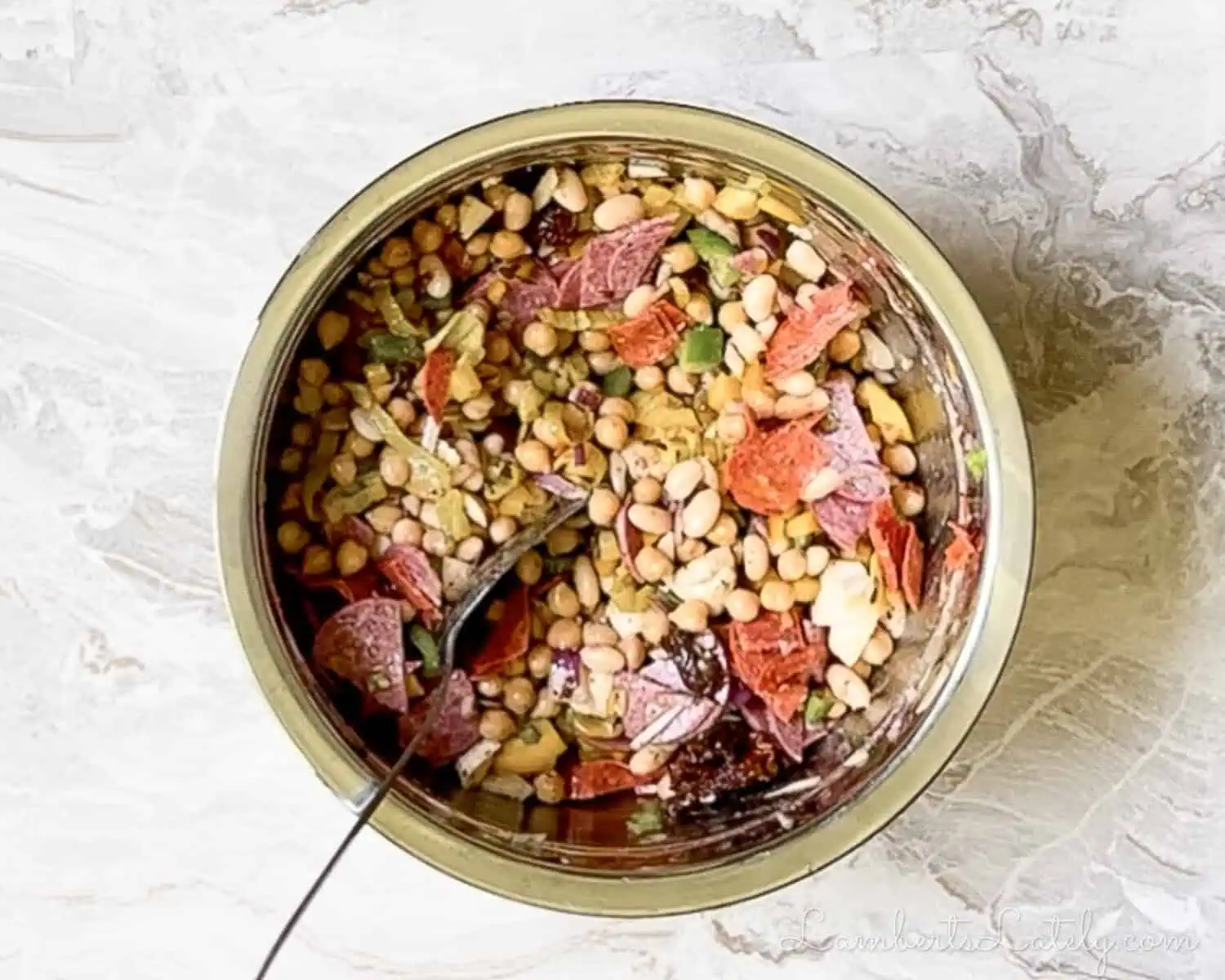 mixed dense bean salad in a large mixing bowl.