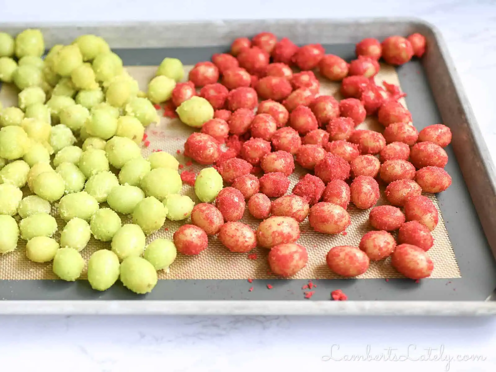 frozen sour patch grapes on a baking sheet.