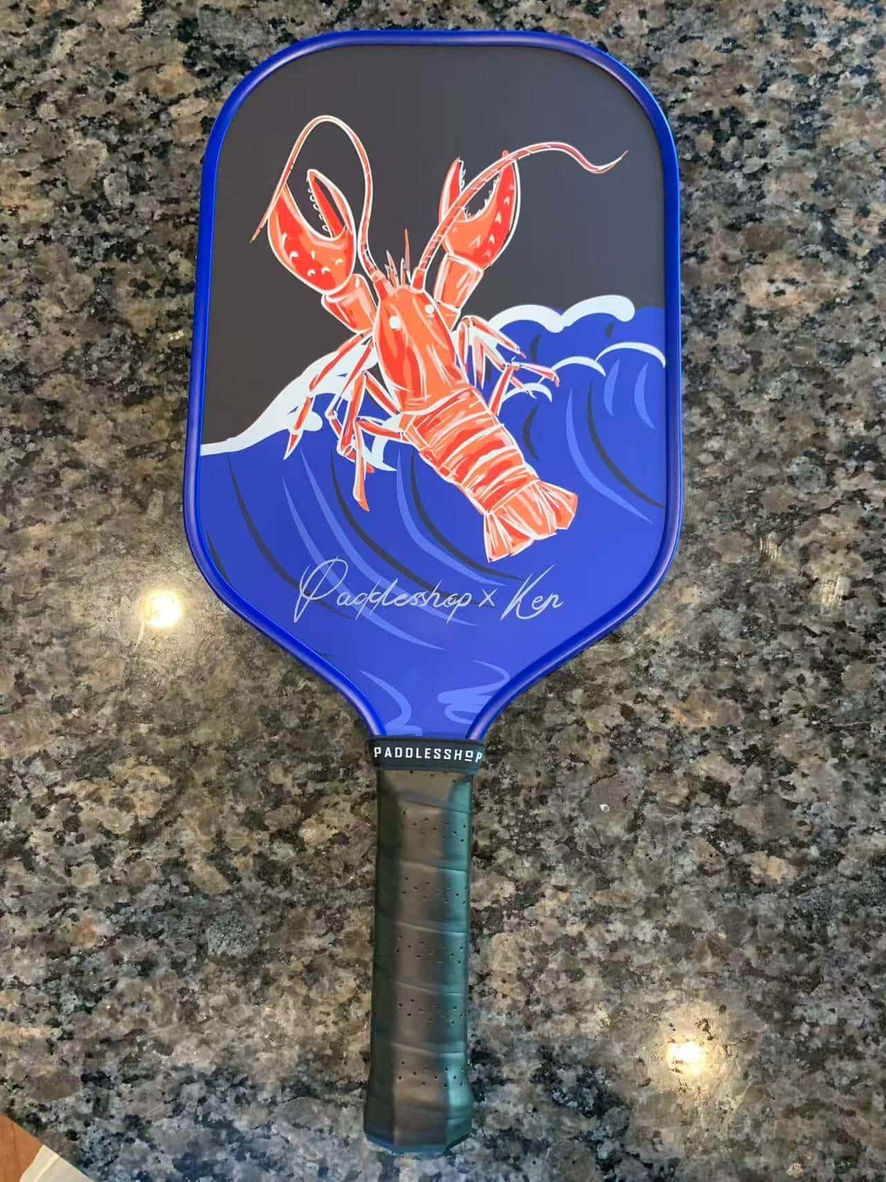 Customized Paddle patterns of lobsters on the beach