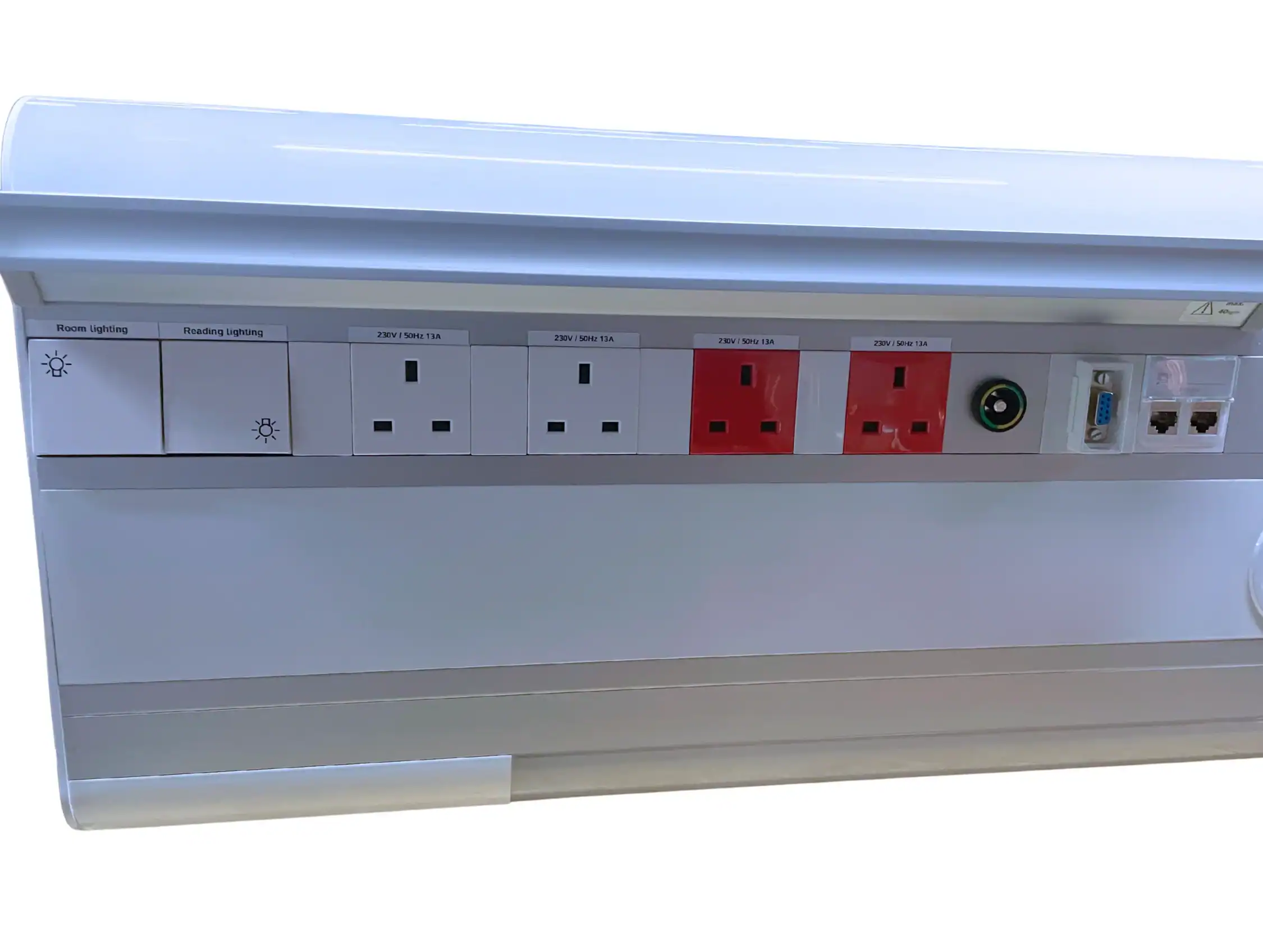 A close up of electrical sockets and facilities on a CPX Bedhead Unit upon a white background
