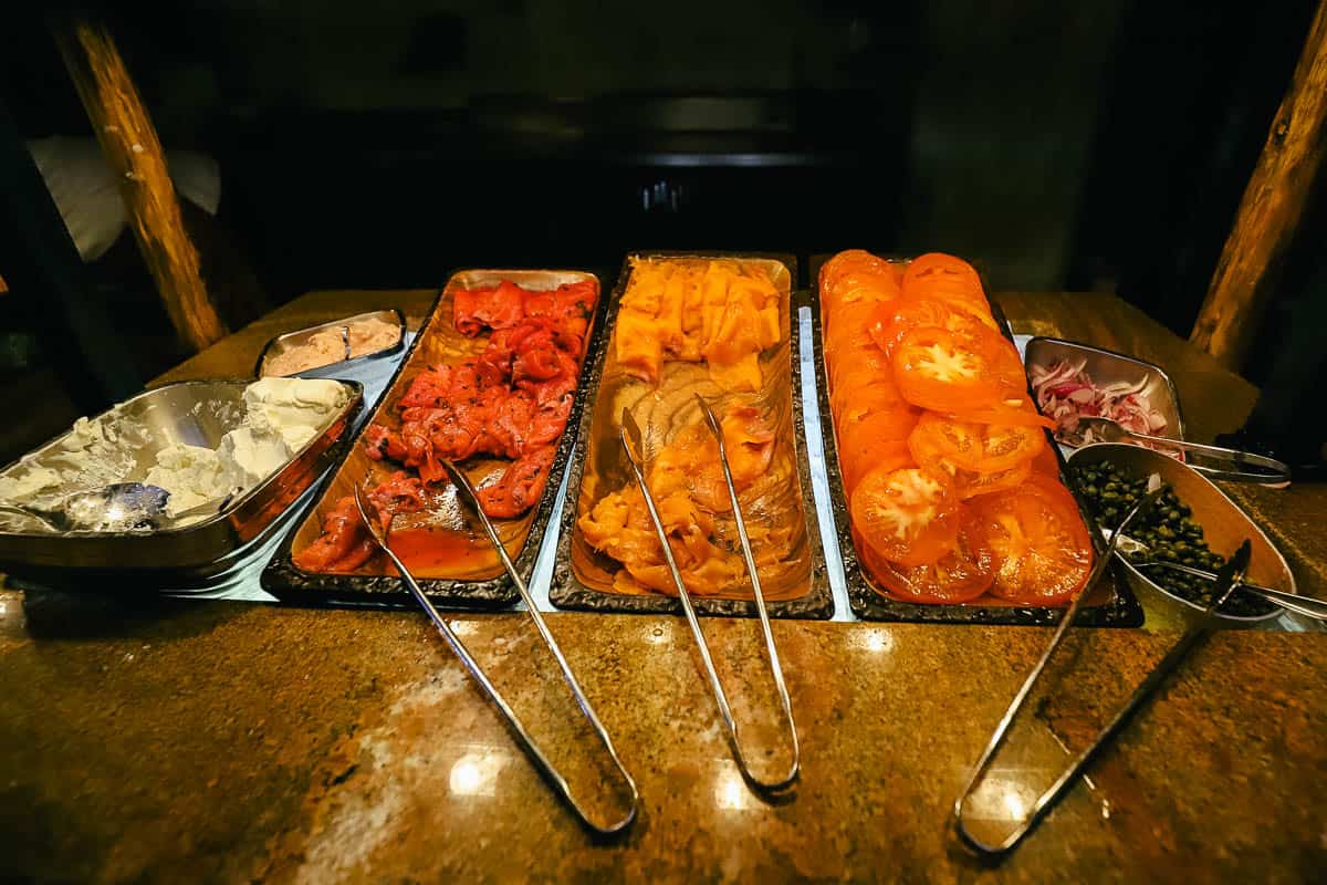 a buffet area with smoked salmon and accompaniments 