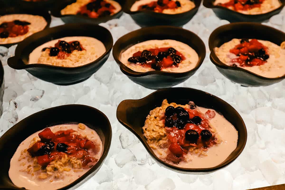 individual dishes of overnight oats with fruit topping 