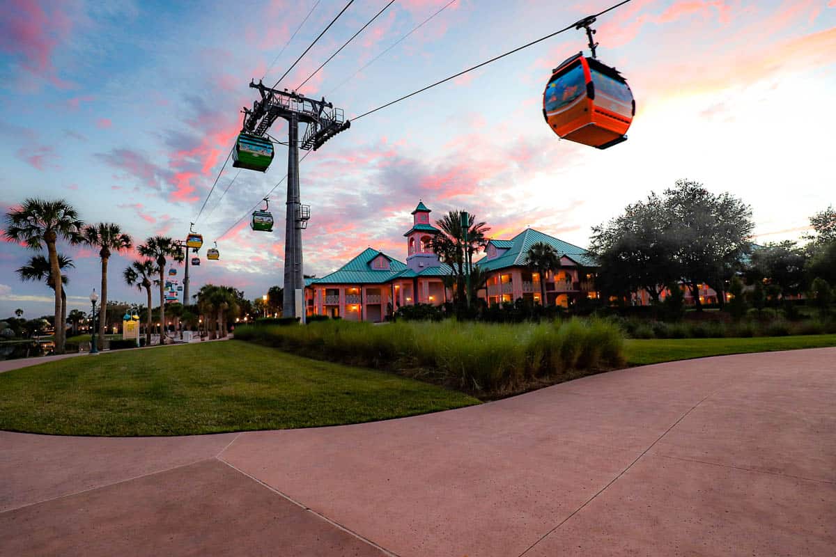the Skyliner traveling over Caribbean Beach at sunset