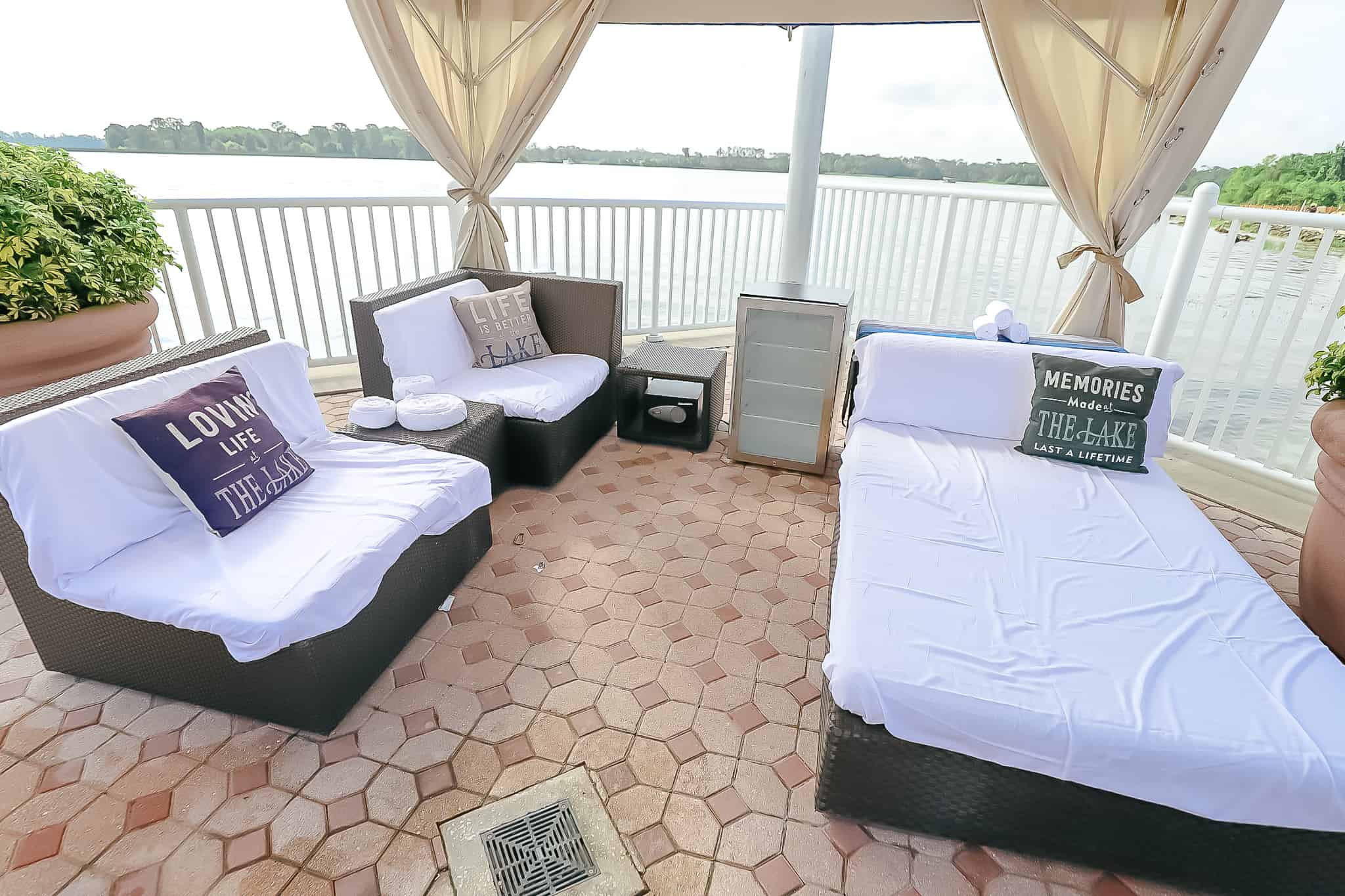 A couch with pillows and a cabana bed.